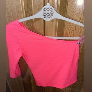 Pink top. One shoulder